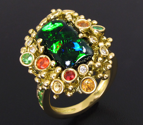 Золото Кольцо с черным опалом и самоцветами