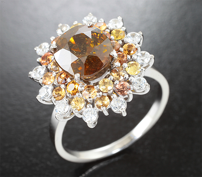 Золото Кольцо с золотисто-желтым сфеном высокой дисперсии 3 карата и разноцветными сапфирами