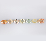 Брошь с зеленым апатитом авторской огранки 4,39 карата, спессартинами гранатами 5,47 карата, цаворитами гранатами 3,79 карата, разноцветными и бесцветными сапфирам