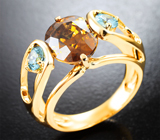 Кольцо с желтым 6,65 карата и голубыми цирконами